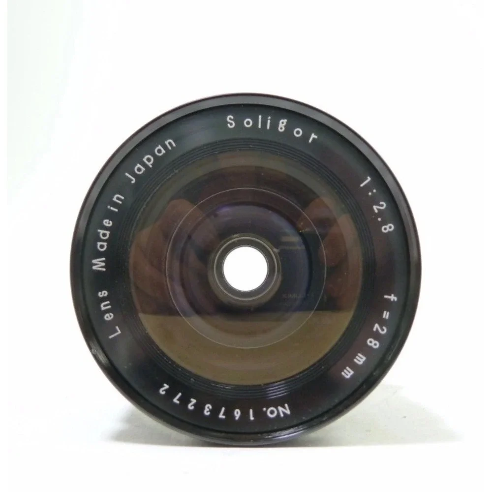 Soligor 28mm f2.8 Wide Angle Lens Japan H69902 with Braun Cap and Case